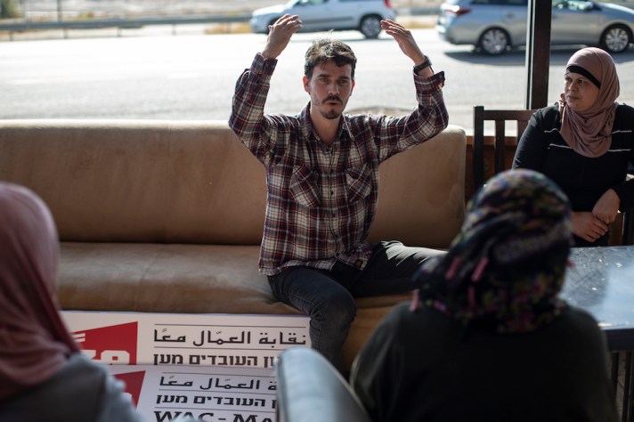 WAC-MAAN representative Yoav Tamir speaks to Palestinian workers on strike during a solidarity meeting in Almog junction, West Bank, December 5, 2019. (Activestills.org)