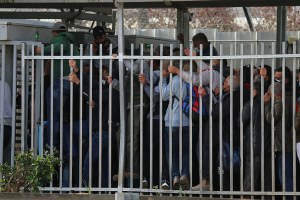 Palestinian workers in line to receive COVID-19 vaccinations at the Qalqilya checkpoint, the West Bank. (Photo: Activestills)